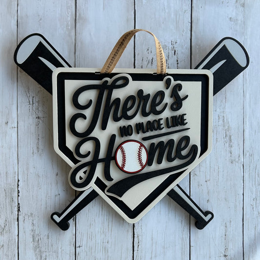 Decorative sign with 'There's no place like home' quote and baseball design on a wooden background